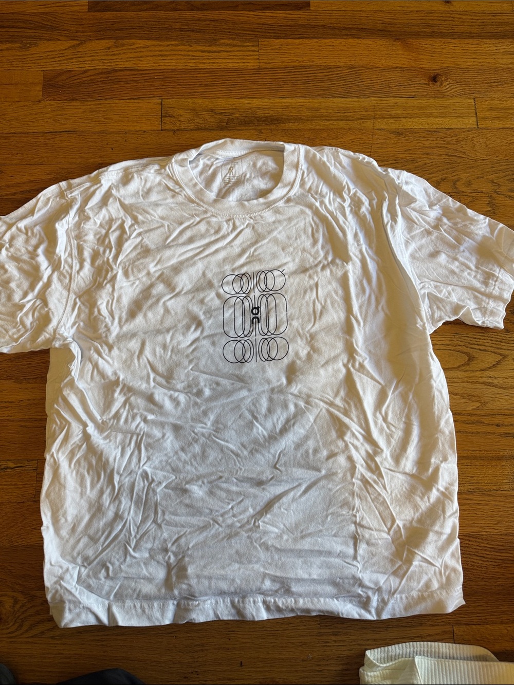 On Running White Crewneck T-Shirt with Black Geometric Logo